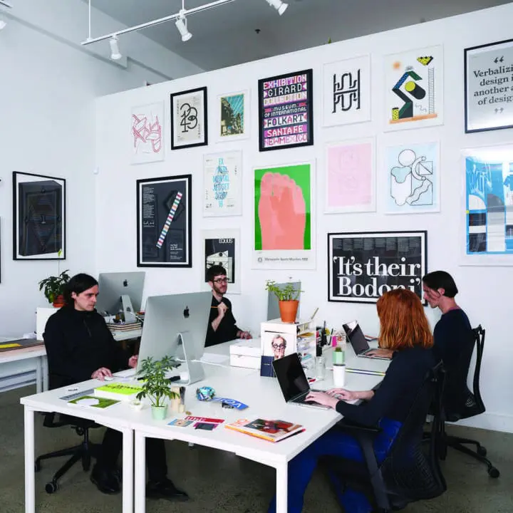 Civilization at our former office/gallery space working at desks, surrounded by modern ...