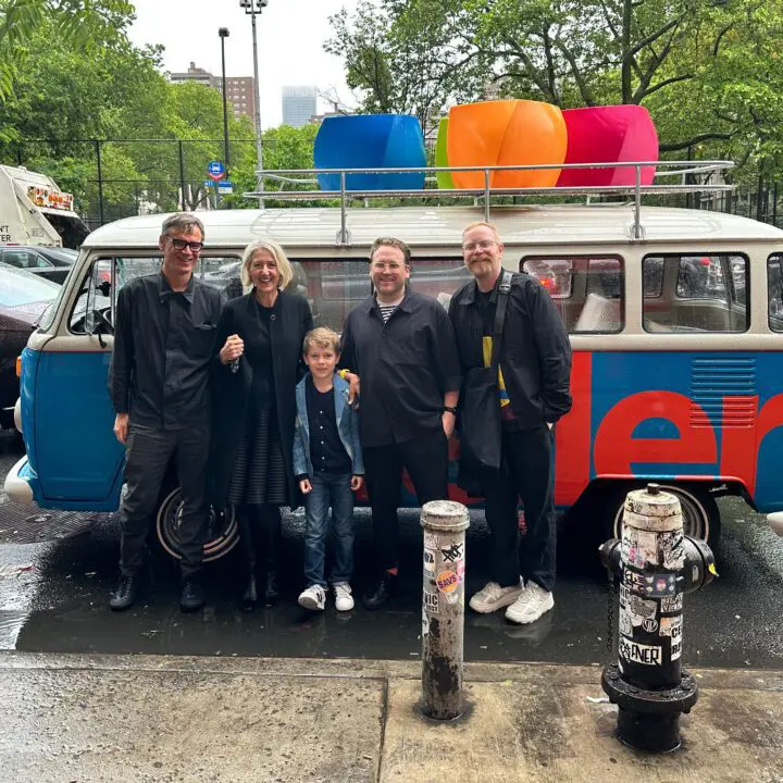 Corey Gutch and Michael Ellsworth of Civilization and Caroline Baumann with family posi...