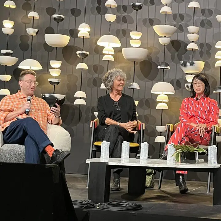 Michael Ellsworth, Nancy Bendtsen, and Ming-Lee Yuan in a panel discussion on stage, at...