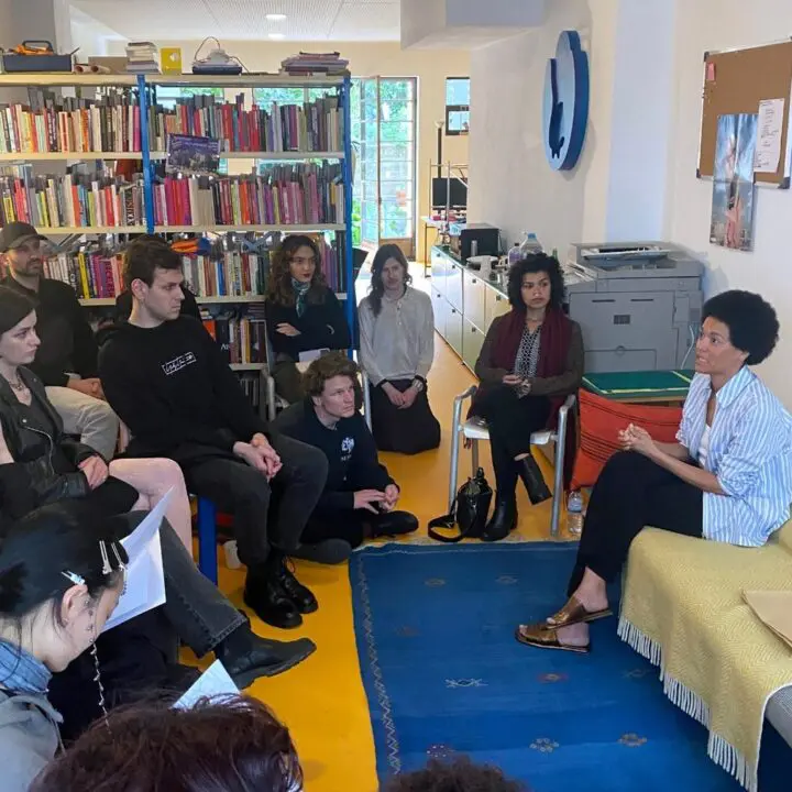 Raya Leary engages with a group listening to her lecture at Bikini Books in Porto, Port...