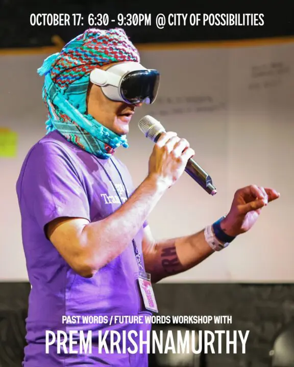 Person wearing VR headset and colorful headscarf speaking at Past Words/Future Words ev...