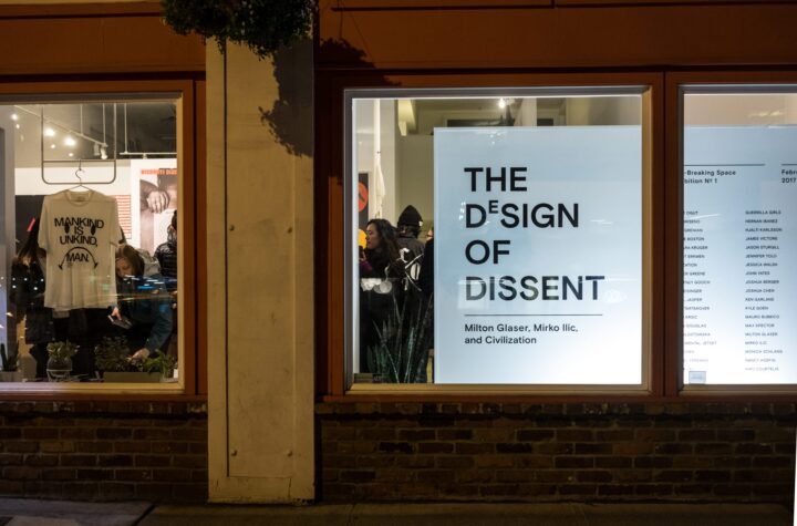 Display of The Design of Dissent exhibition poster and T-shirt, featuring thought-provoking artwork and messages.