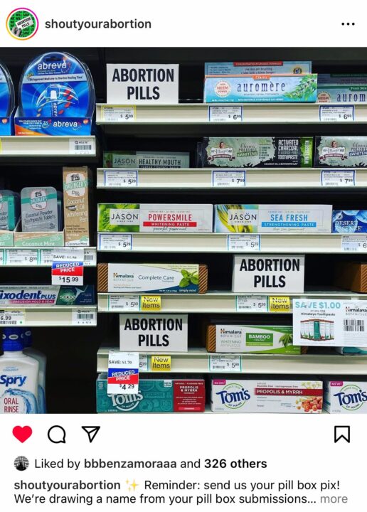Store shelf displaying dental care products labeled as ABORTION PILLS for a campaign.