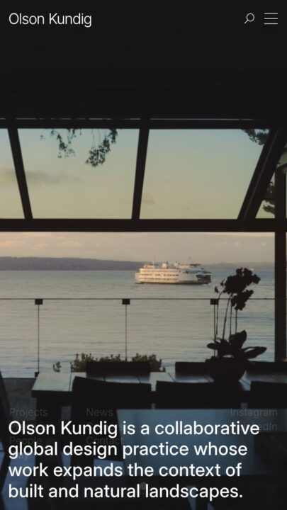 Modern interior with sea view, ferry in distance. Olson Kundig text highlights their gl...