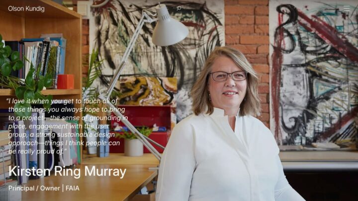 Architect in an office setting with artwork and plants. Quote emphasizes sustainable de...