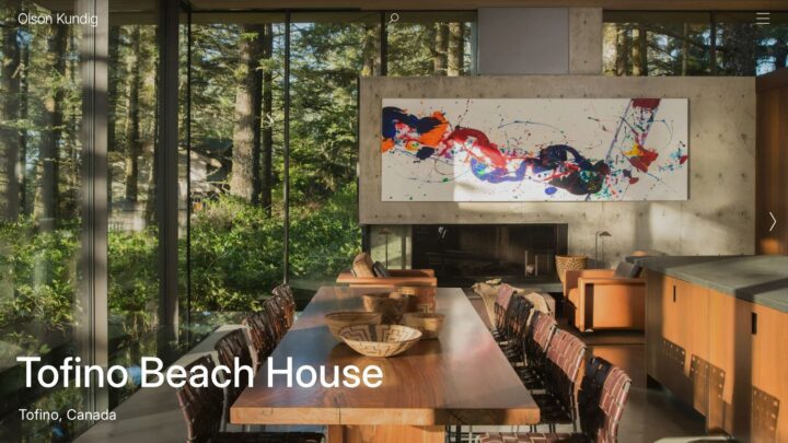 Modern dining area with large windows and abstract art in Tofino Beach House, surrounde...
