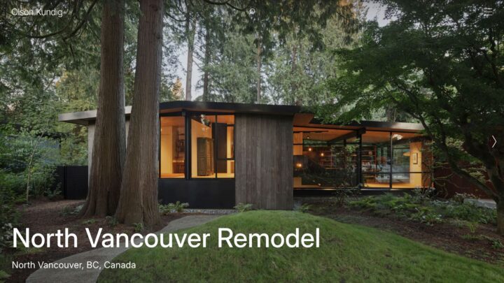 Modern North Vancouver home remodel surrounded by lush forest and large glass windows s...