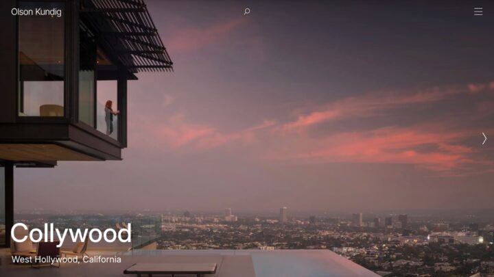 Modern house with sunset city view, West Hollywood. Woman on balcony enjoying skyline, ...