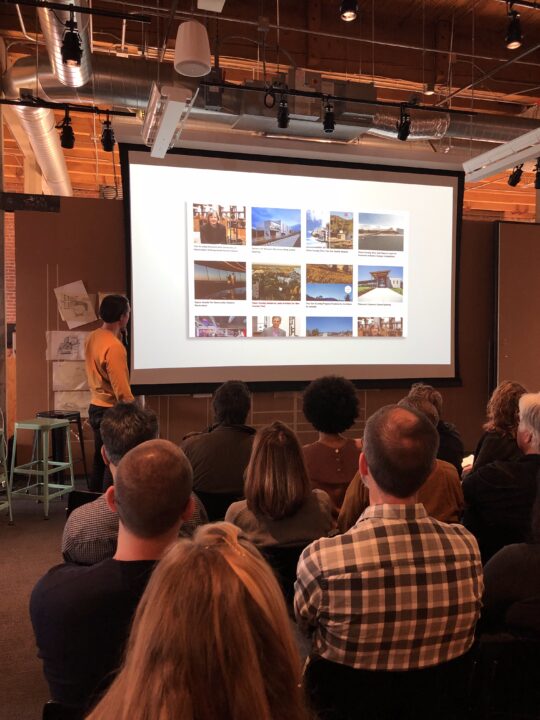 Shaun Kardinal presenting our website design to the Olson Kundig staff at their Seattle office with a slide showing of the layout storytelling element of the website.