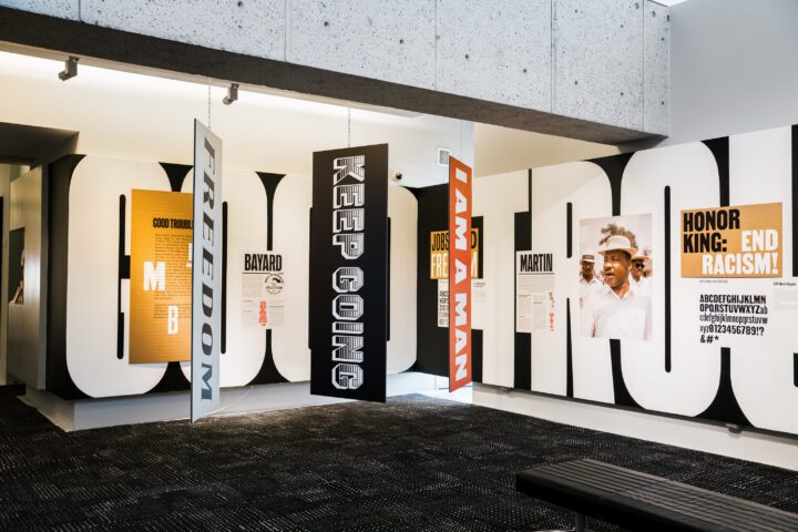 Exhibit with banners reading Freedom, Keep Going, and I Am A Man, highlighting civil ri...