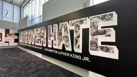 Exhibit wall with Martin Luther King Jr. quote: Hate cannot drive out hate, only love can do that.