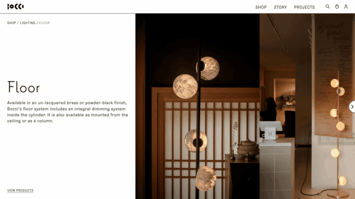 Modern floor lamps with spherical lights on display in a stylish setting, showcasing Bo...