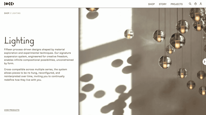 Modern pendant lights with glass spheres and soft shadows on a wall, creating a minimal...