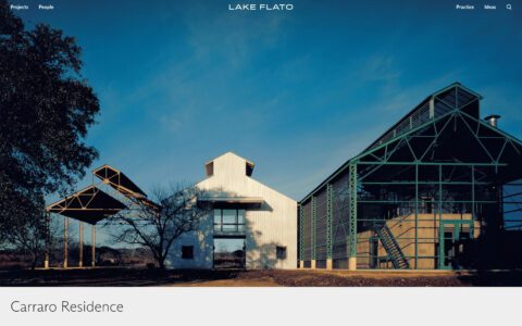 Modern architecture of Carraro Residence with metal structures and glass, under a clear blue sky.