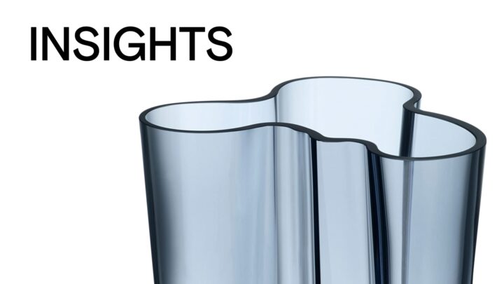 Sleek modern vase with a wavy design in blue glass, showcasing minimalist elegance.