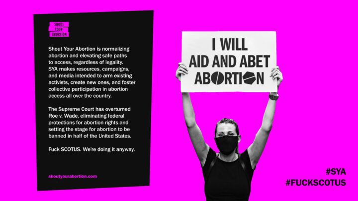 Pro-choice activist holds sign I Will Aid and Abet Abortion with text supporting aborti...